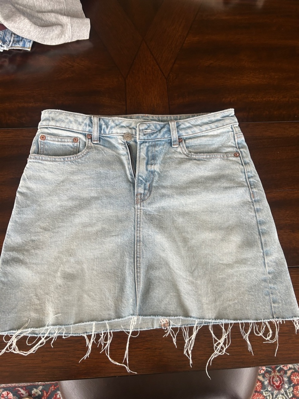 AMERICAN EAGLE Light Wash Denim Frayed Hem Mini Skirt - Women